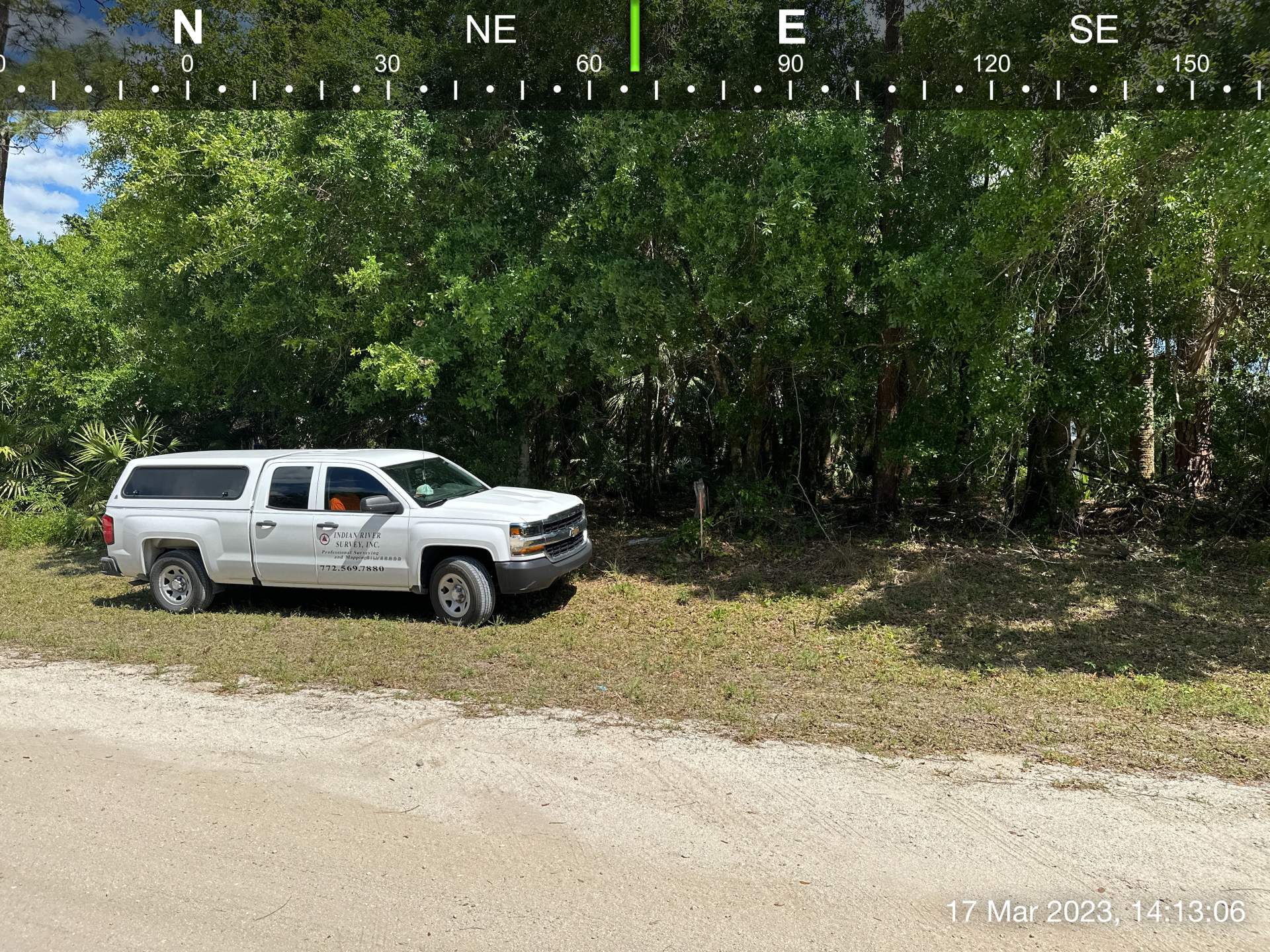 TRUCK AT WOODED LOT BOUNDARY SURVEY